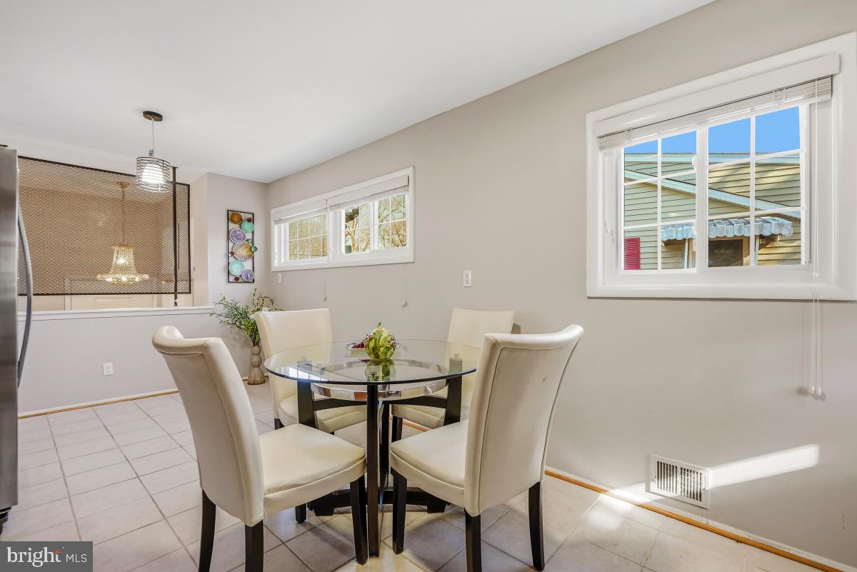 1021 Brice Road Rockville, MD 20852 - Photo 15 of 44 a view of a dining room with furniture and window