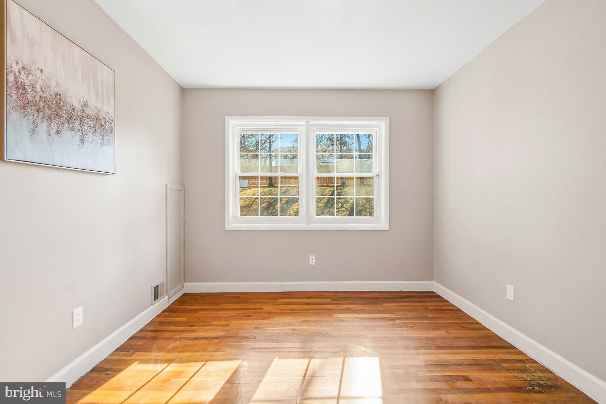 1021 Brice Road Rockville, MD 20852 - Photo 27 of 44 a view of a room with wooden floor and window