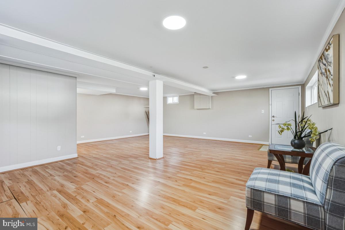 1021 Brice Road Rockville, MD 20852 - Photo 32 of 44 a view of a livingroom with furniture and wooden floor