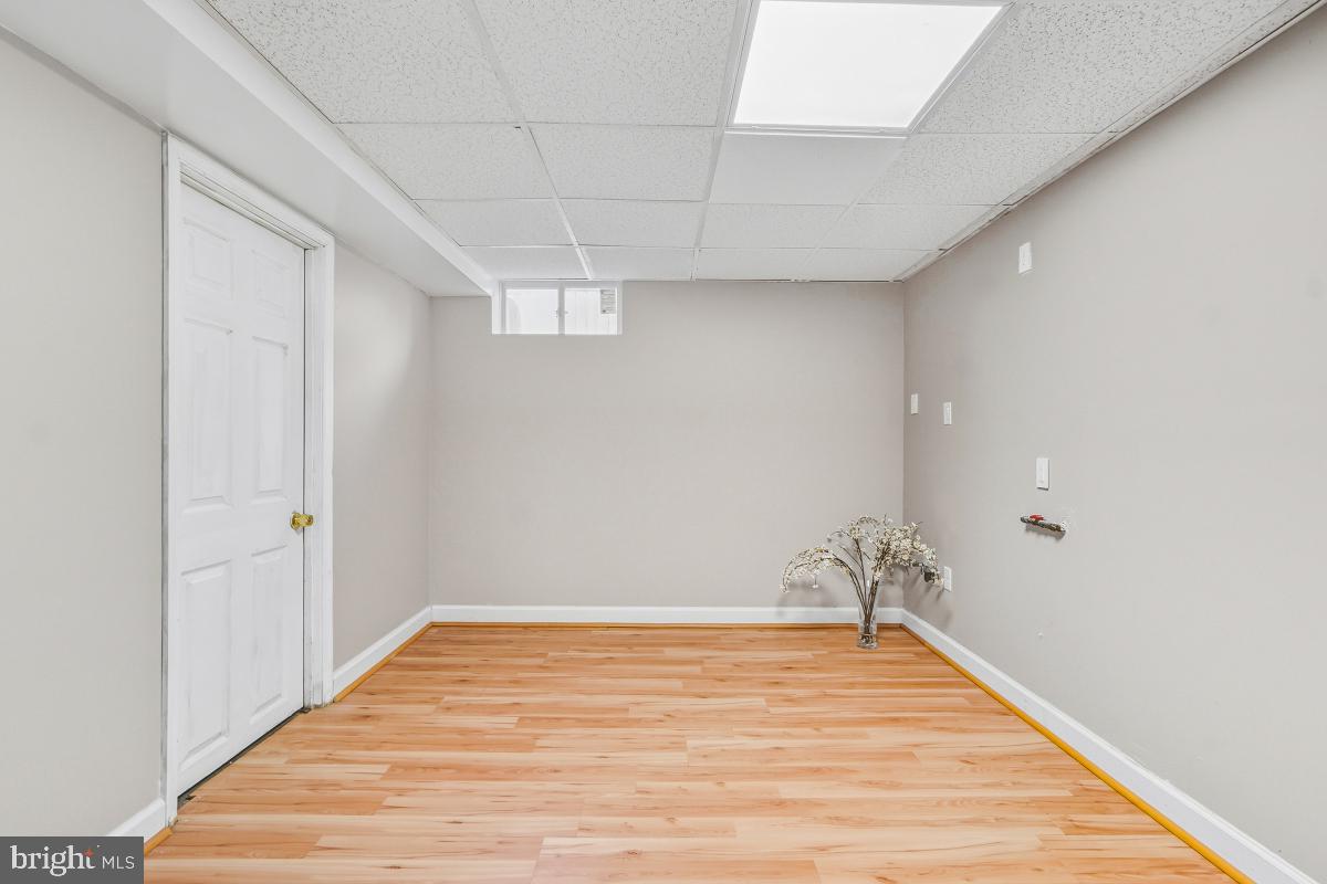 1021 Brice Road Rockville, MD 20852 - Photo 40 of 44 a view of a room with wooden floor