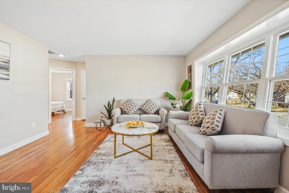 1021 Brice Road Rockville, MD 20852 - Photo 4 of 44 a living room with furniture and a large window