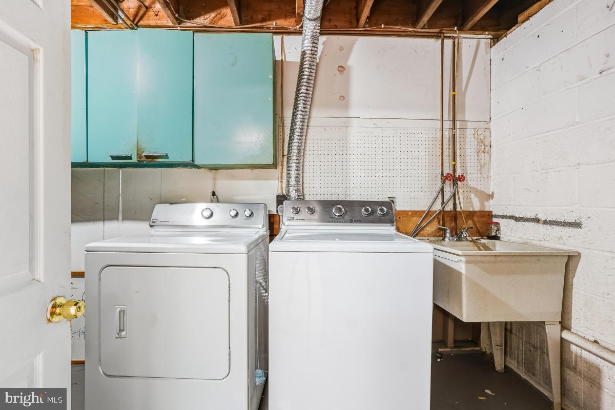 1021 Brice Road Rockville, MD 20852 - Photo 41 of 44 a utility room with dryer and washer