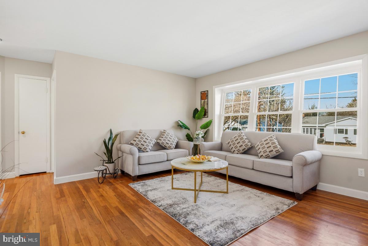 1021 Brice Road Rockville, MD 20852 - Photo 6 of 44 a living room with furniture and a large window