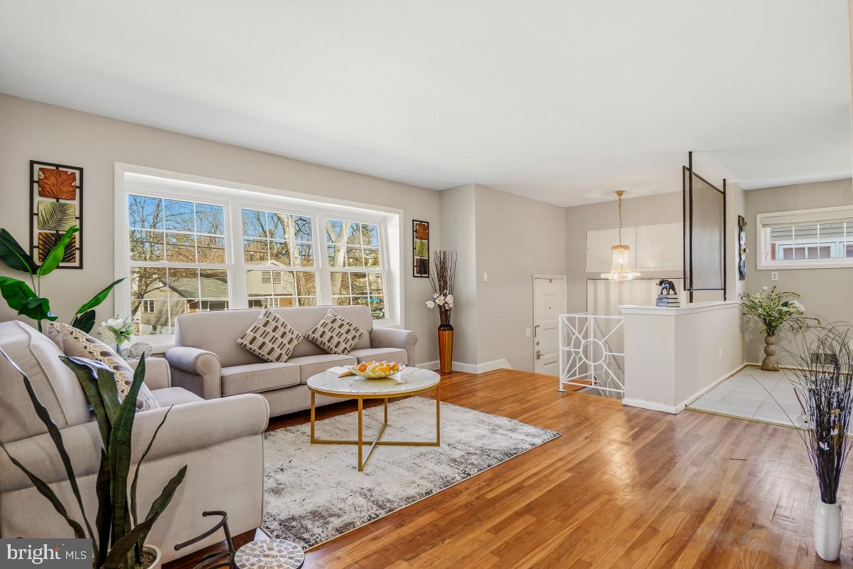 1021 Brice Road Rockville, MD 20852 - Photo 7 of 44 a living room with furniture and a table