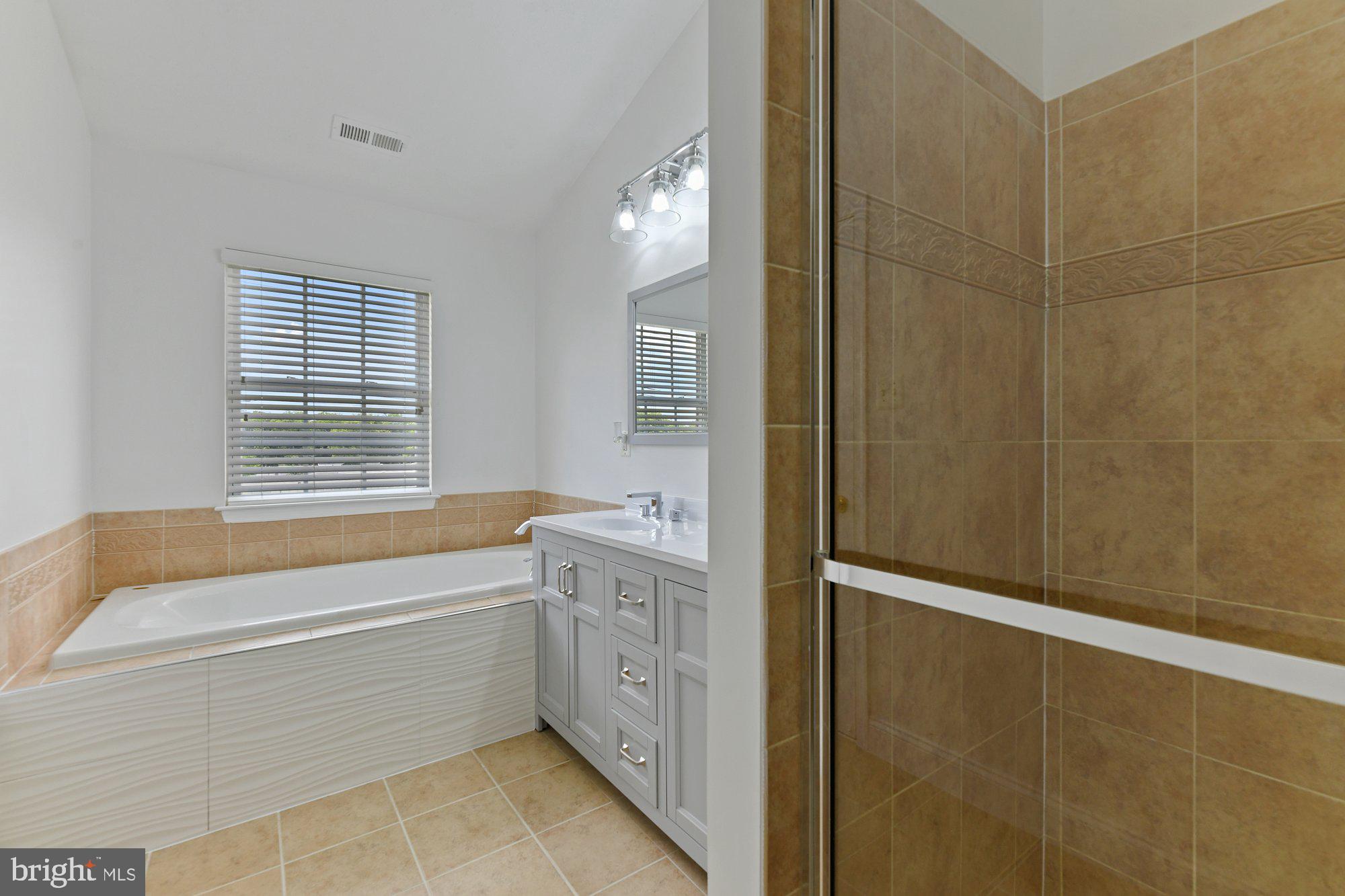 827 Middle River Road Baltimore, MD 21220 - Photo 15 of 29 Primary bathroom with soaking tub
