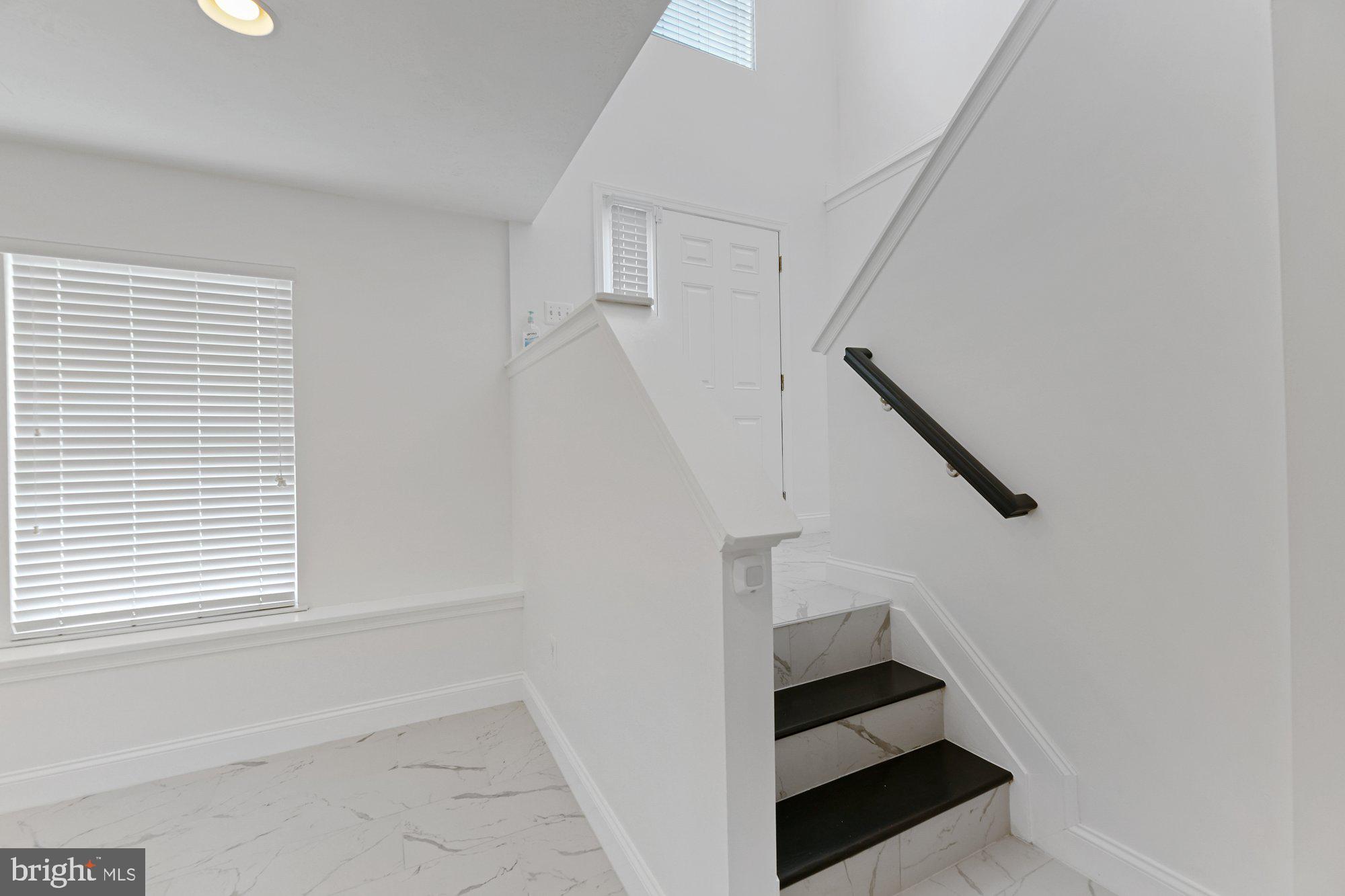 827 Middle River Road Baltimore, MD 21220 - Photo 19 of 29 Staircase leading to lower level