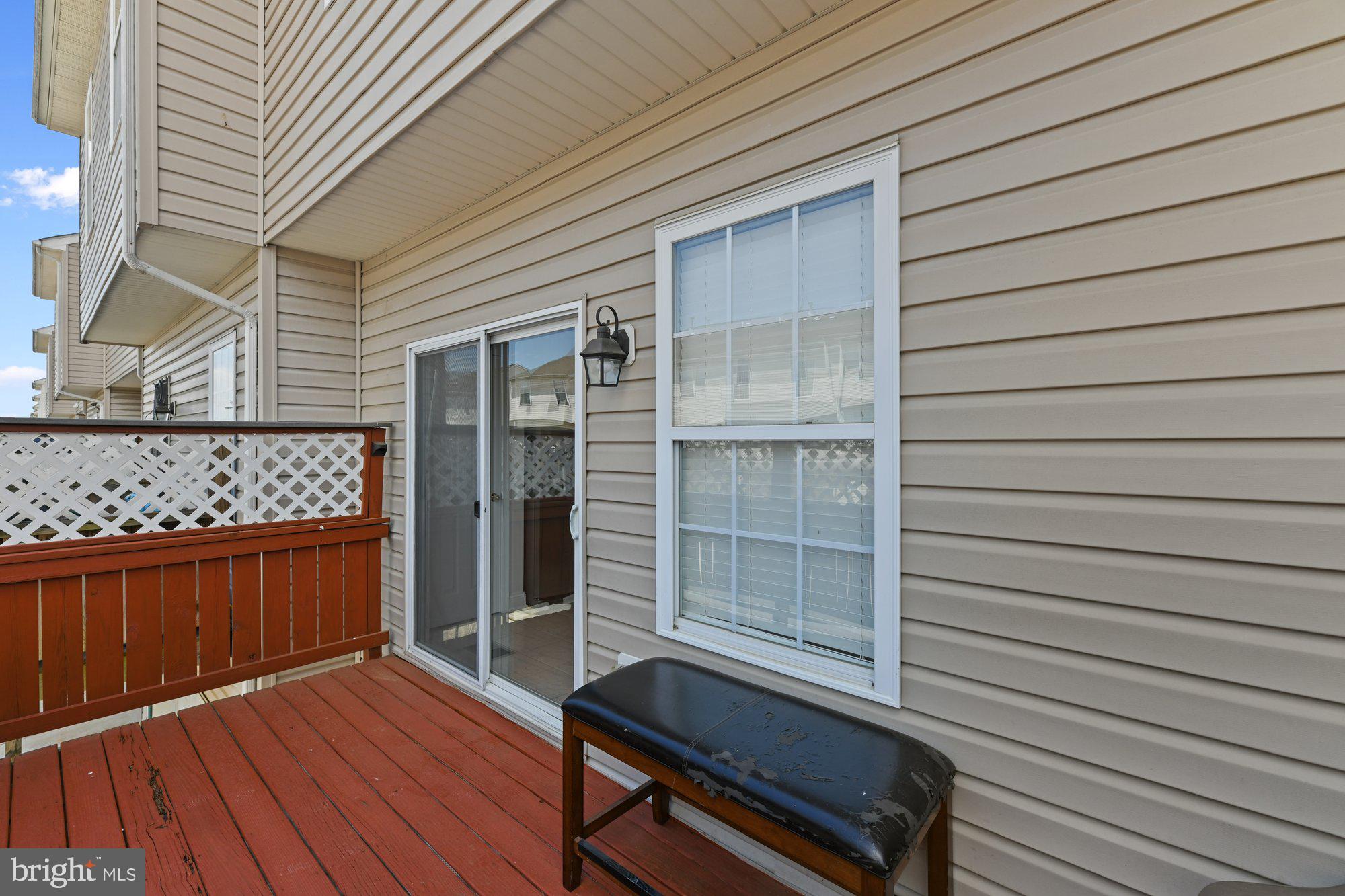 827 Middle River Road Baltimore, MD 21220 - Photo 24 of 29 Sliders from kitchen leading to deck