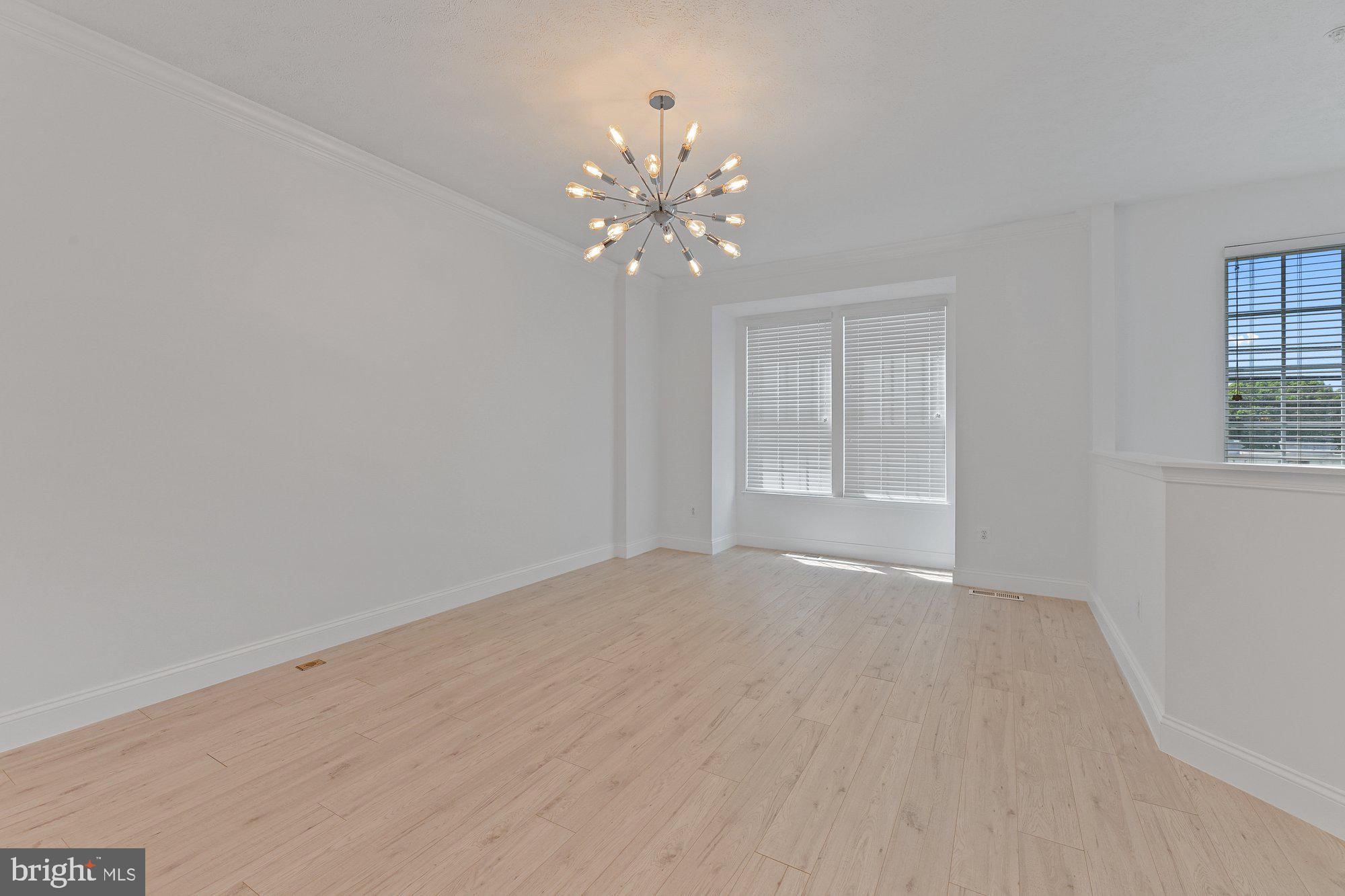 827 Middle River Road Baltimore, MD 21220 - Photo 4 of 29 Living room with fresh paint & new flooring