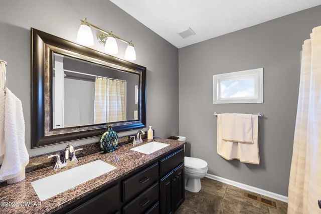 a bedroom with bed and window