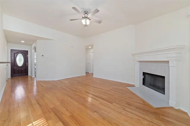 a view of an empty room with a fireplace
