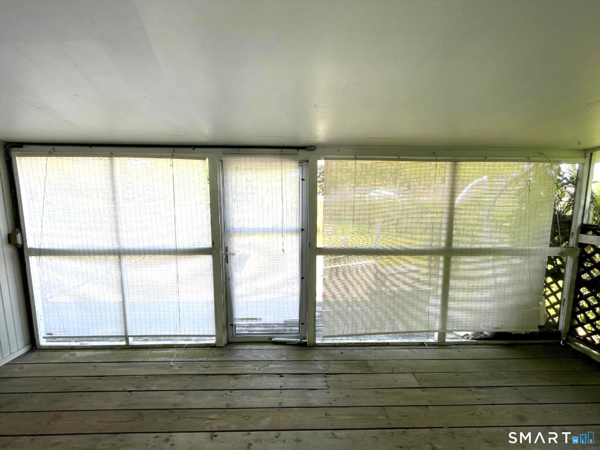 18 Old South Cove Road Old Saybrook, CT 06475 - Photo 25 of 40 a view of wooden floor and windows in an empty room