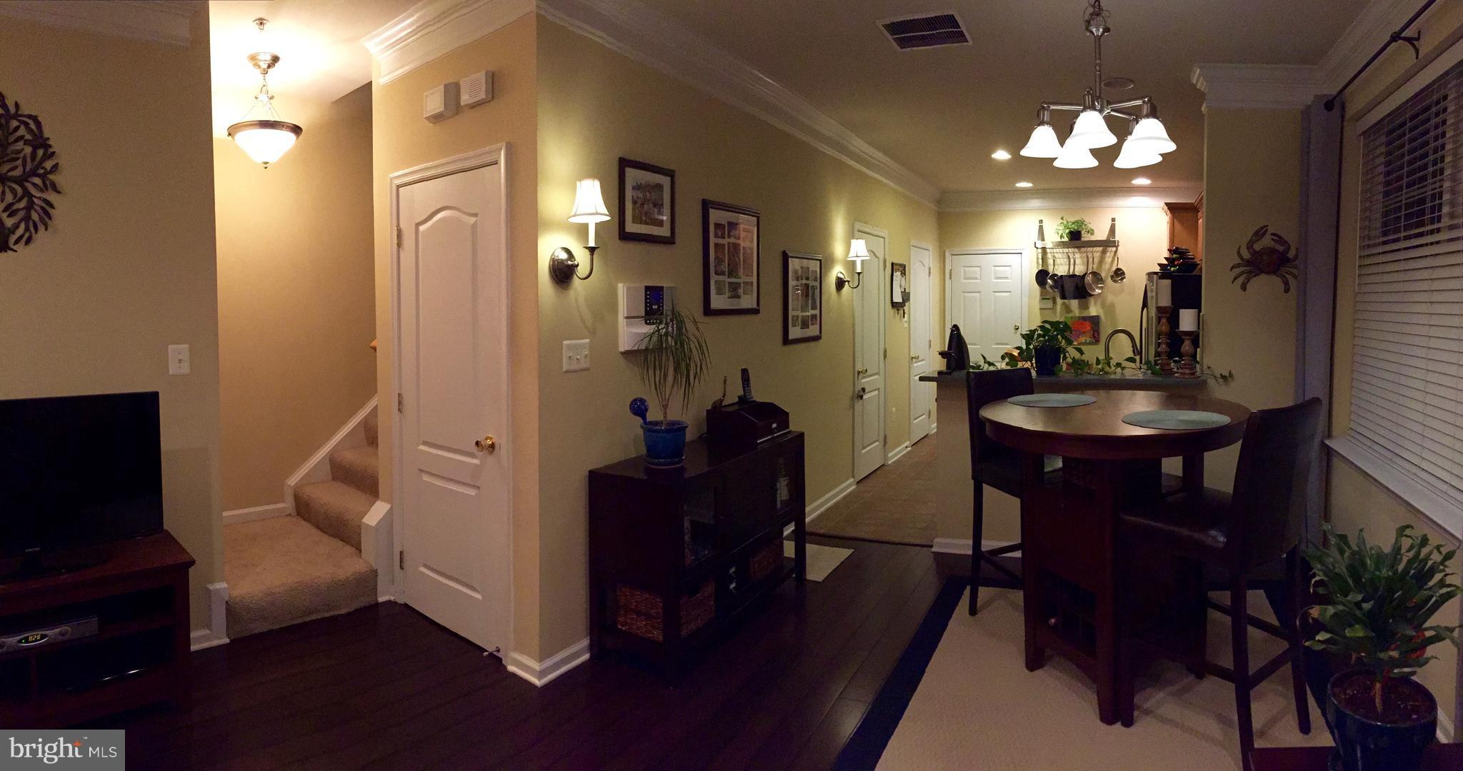 12432 Liberty Bridge Road, Unit A Fairfax, VA 22033 - Photo 2 of 14 a very nice looking dining room with furniture and a chandelier