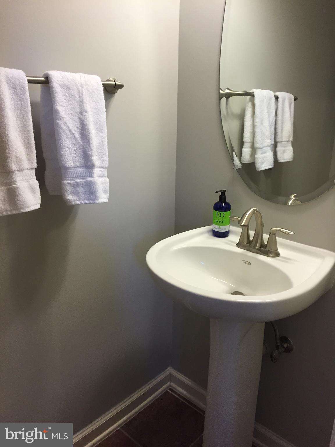 12432 Liberty Bridge Road, Unit A Fairfax, VA 22033 - Photo 6 of 14 a bathroom with a sink and mirror