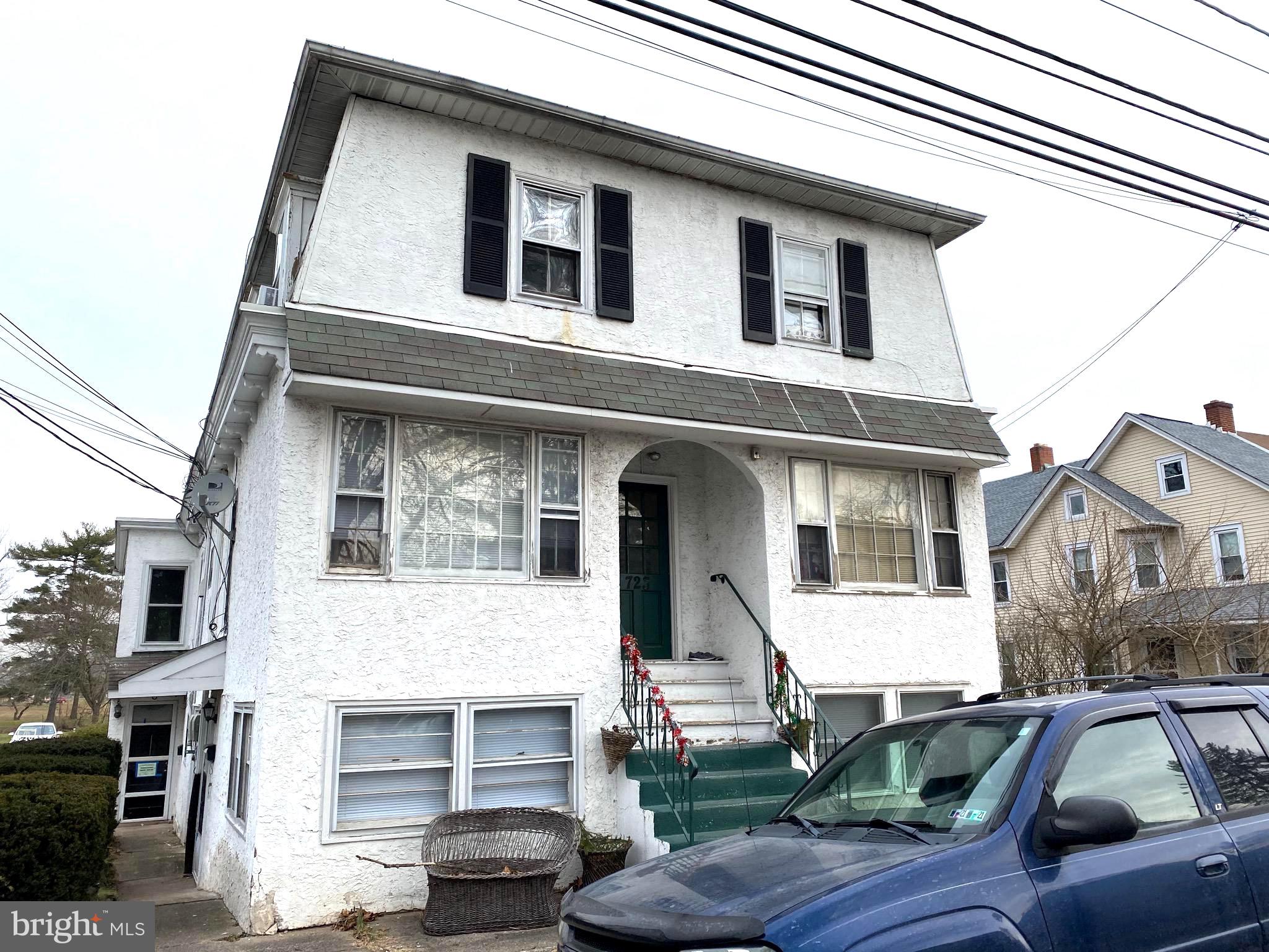 725 West Broad Street, Unit 4 Quakertown, PA 18951 - Photo 1 of 14 a front view of a house with parking space
