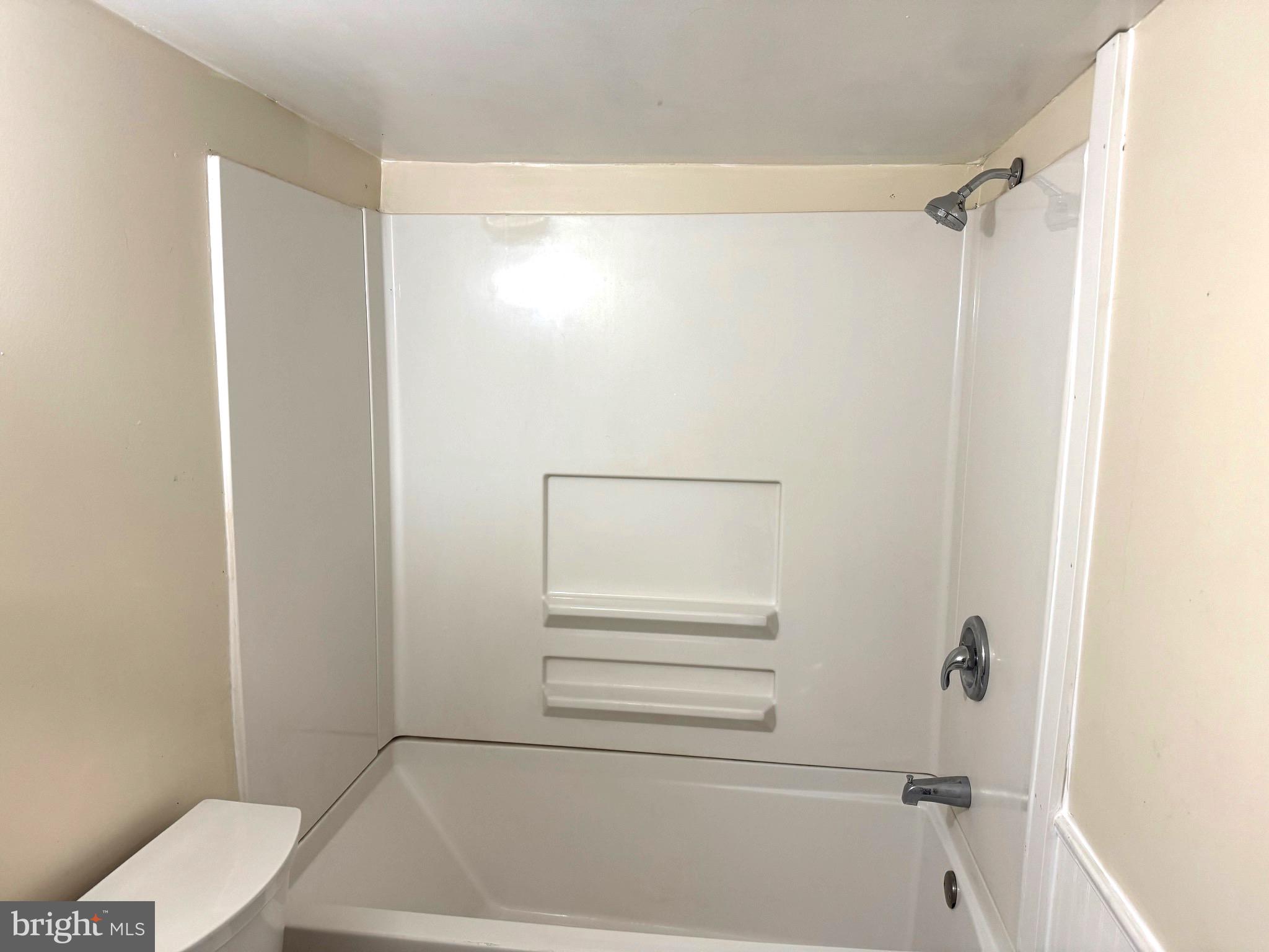 725 West Broad Street, Unit 4 Quakertown, PA 18951 - Photo 13 of 14 a bathroom with a bathtub and a shower
