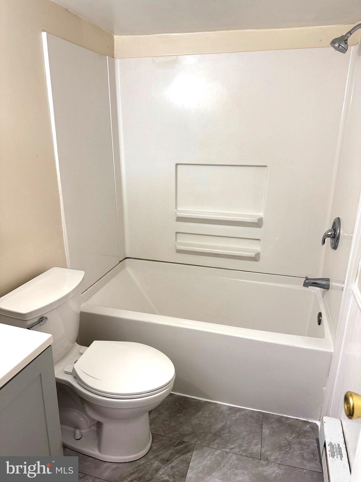 725 West Broad Street, Unit 4 Quakertown, PA 18951 - Photo 14 of 14 a bathroom with a toilet a sink and a bathtub