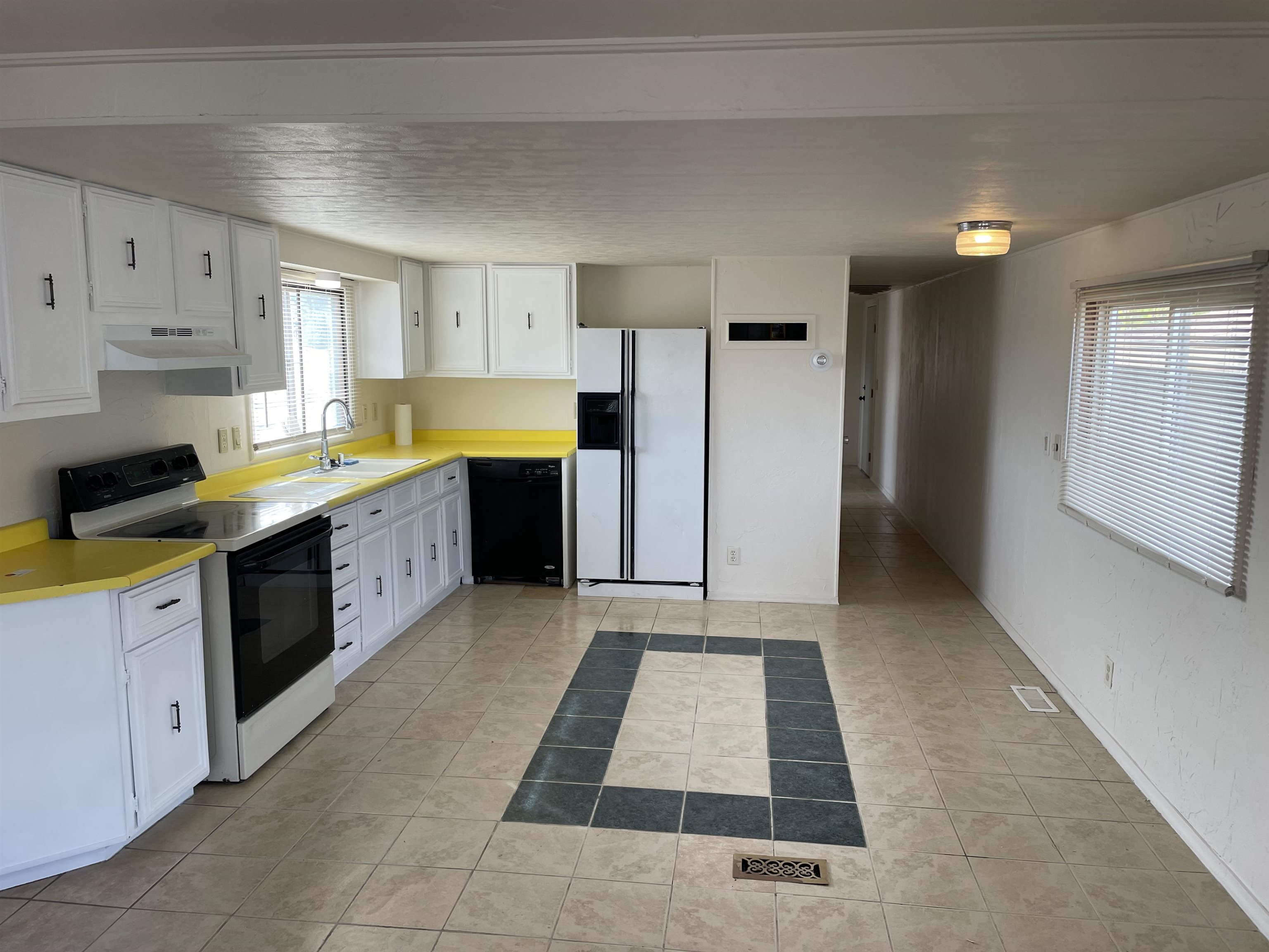 424 32 Road, Unit 194 Clifton, CO 81520 - Photo 3 of 8 a large kitchen with stainless steel appliances granite countertop a refrigerator and a stove