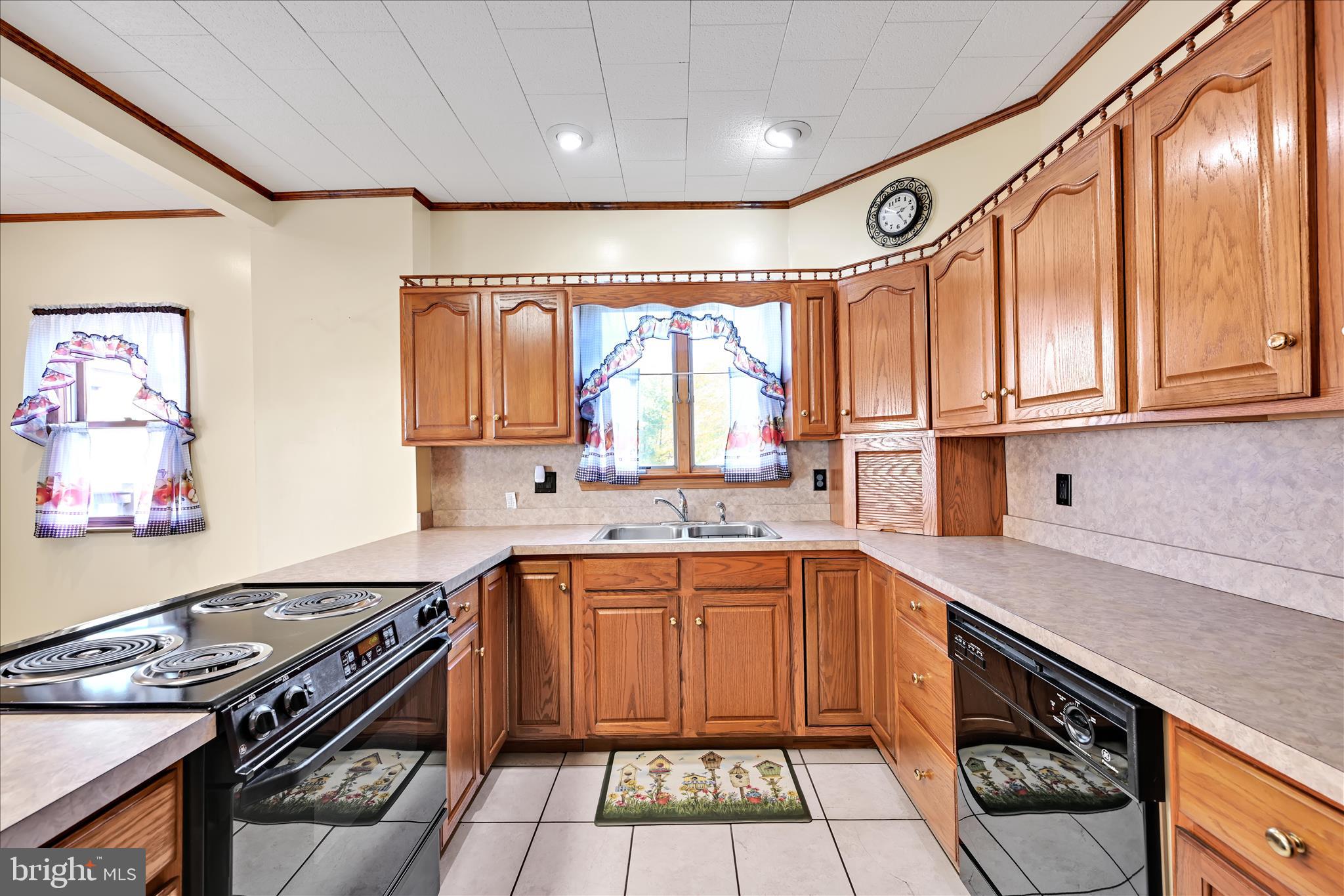 283 South Tulpehocken Street Pine Grove, PA 17963 - Photo 12 of 35 a kitchen with a sink stove top oven and cabinets