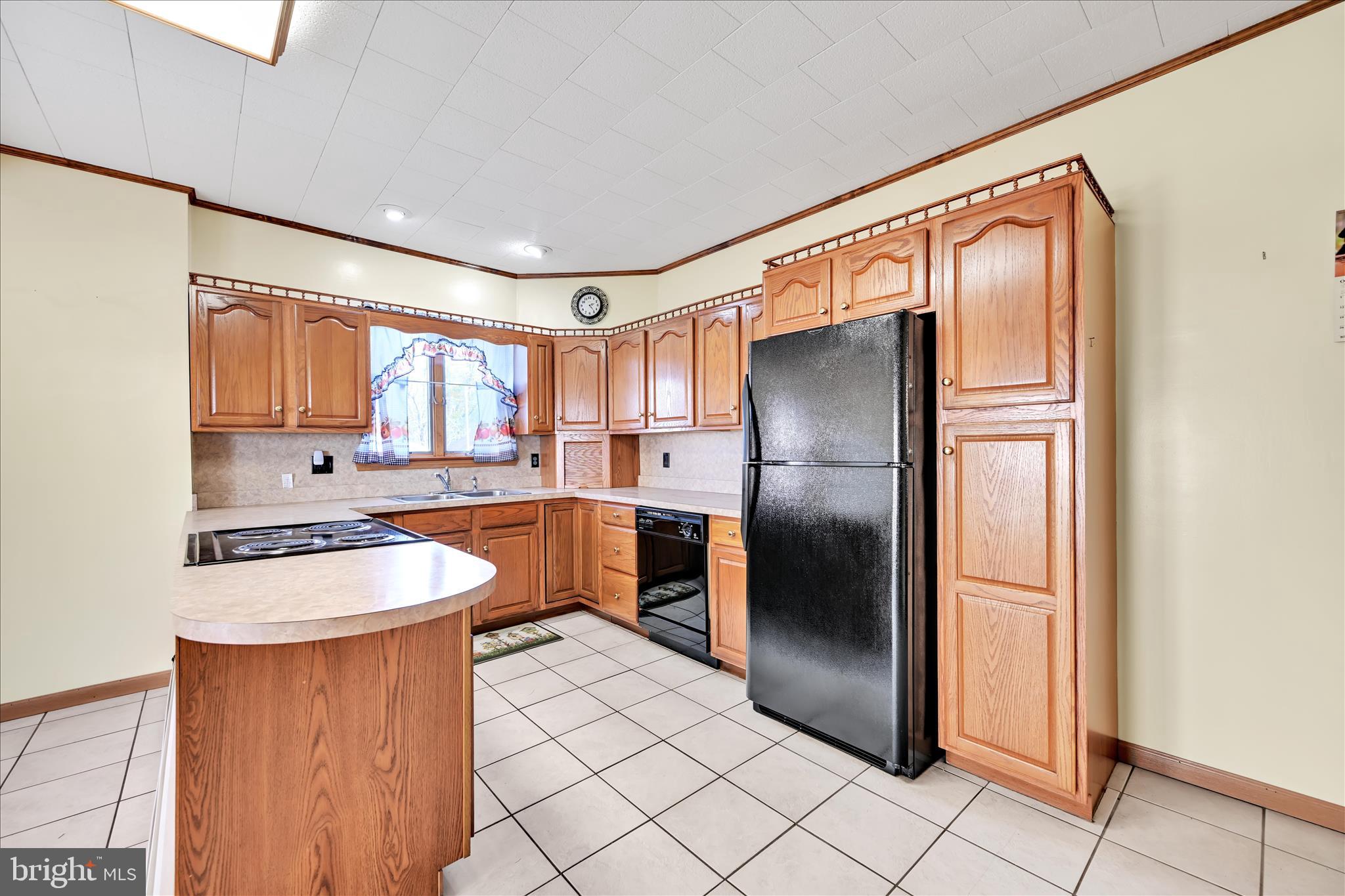 283 South Tulpehocken Street Pine Grove, PA 17963 - Photo 10 of 35 a kitchen with stainless steel appliances granite countertop a refrigerator a stove a sink and dishwasher