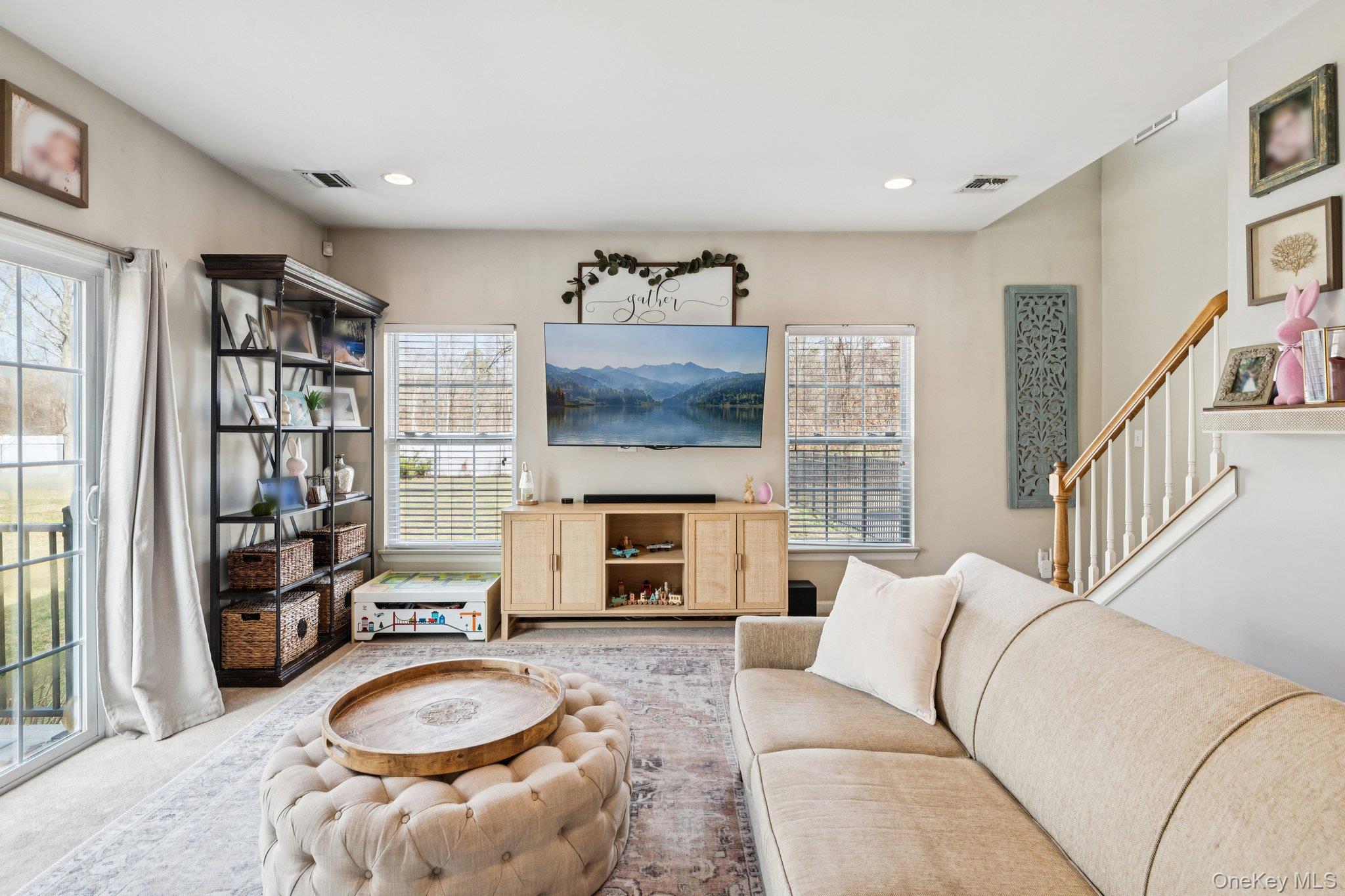 4 Clinton Avenue Bellport, NY 11713 - Photo 11 of 34 a living room with furniture and a flat screen tv
