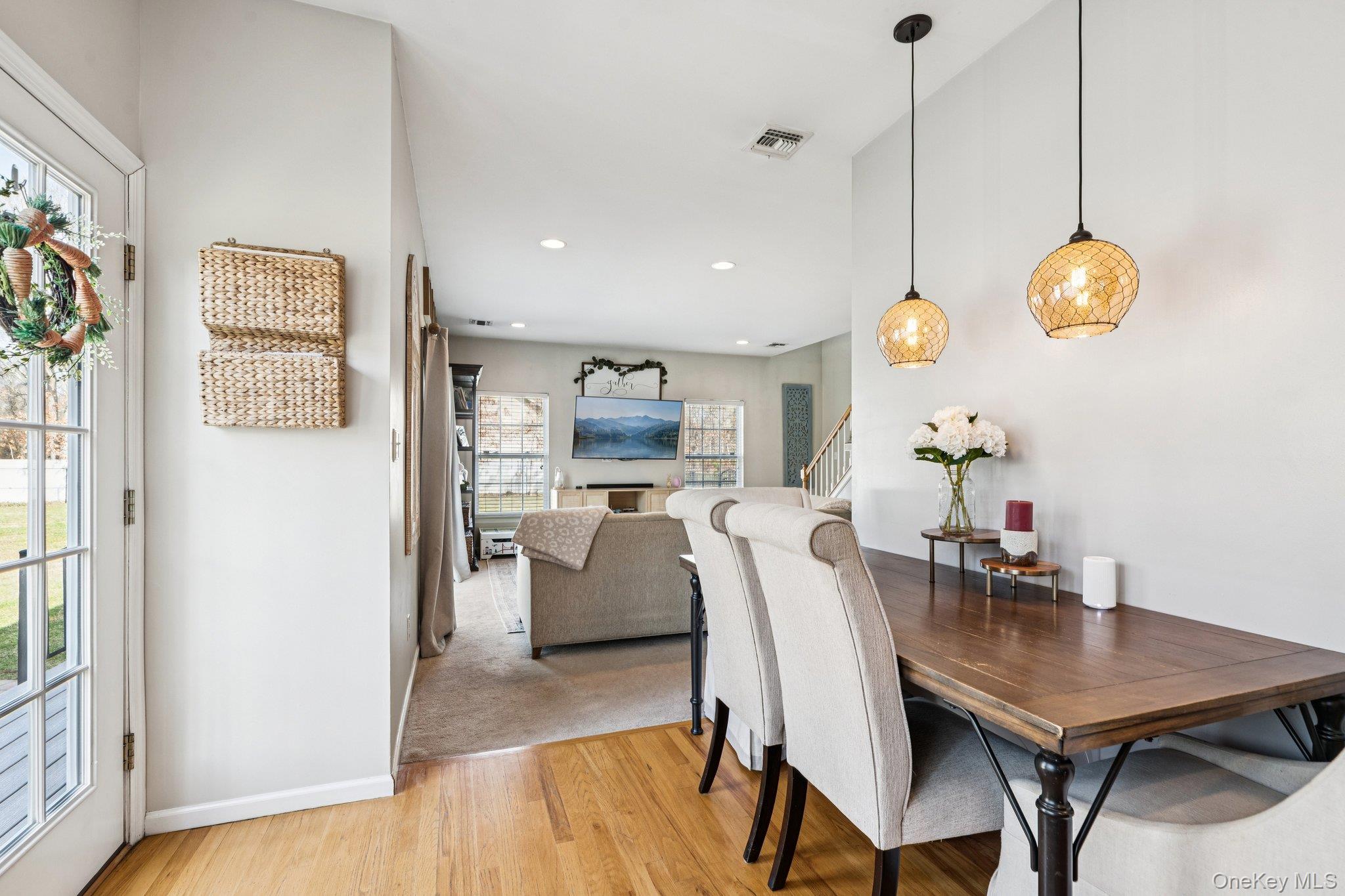 4 Clinton Avenue Bellport, NY 11713 - Photo 17 of 34 a view of a dining room with furniture and wooden floor