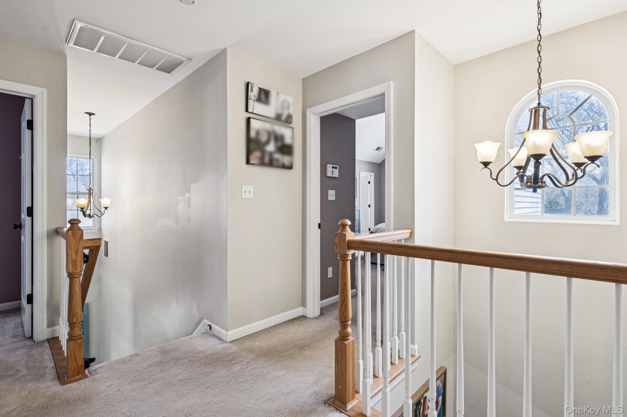 4 Clinton Avenue Bellport, NY 11713 - Photo 19 of 34 a view of a hallway with windows and stairs