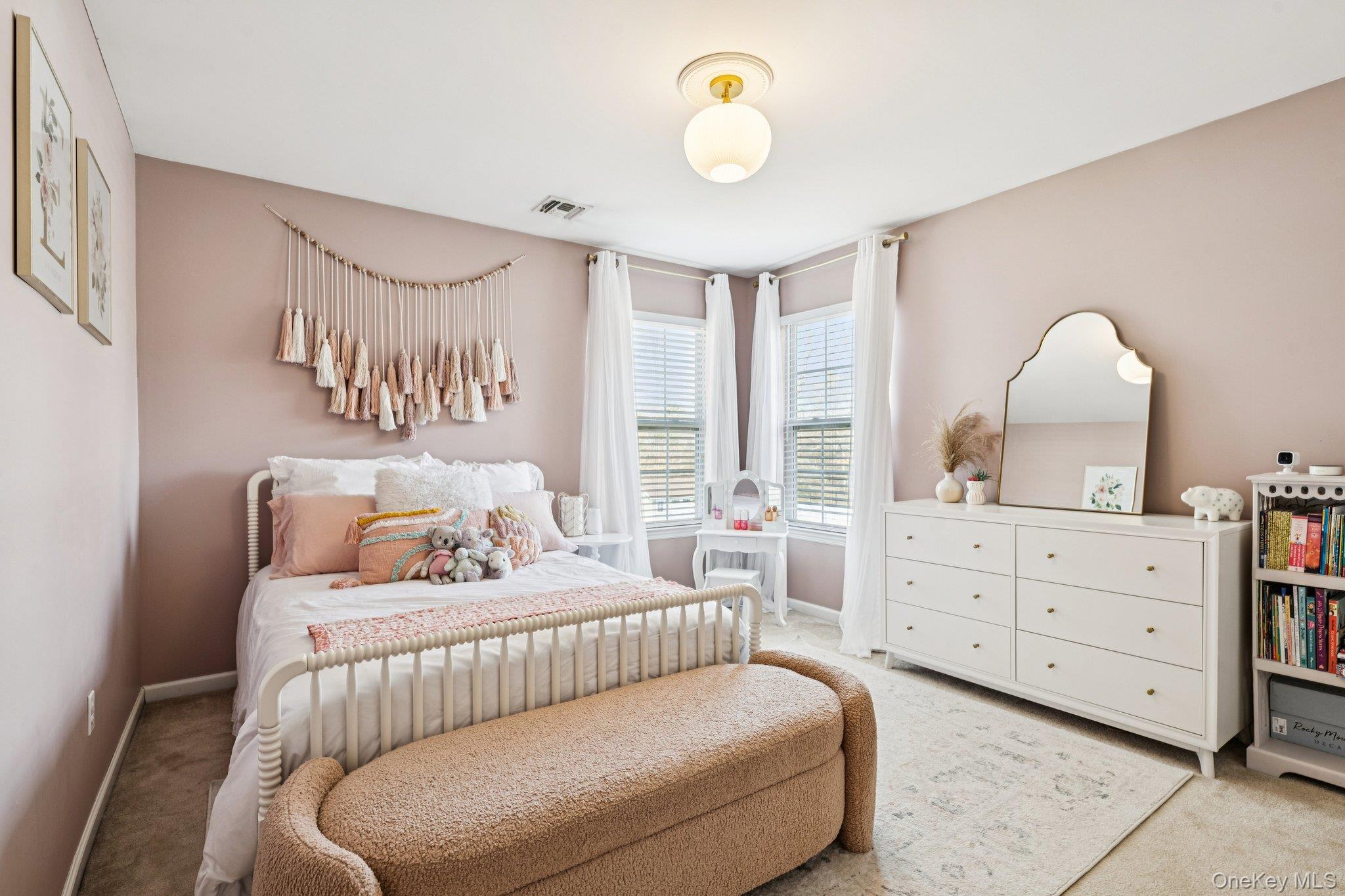 4 Clinton Avenue Bellport, NY 11713 - Photo 20 of 34 a bedroom with a bed and window