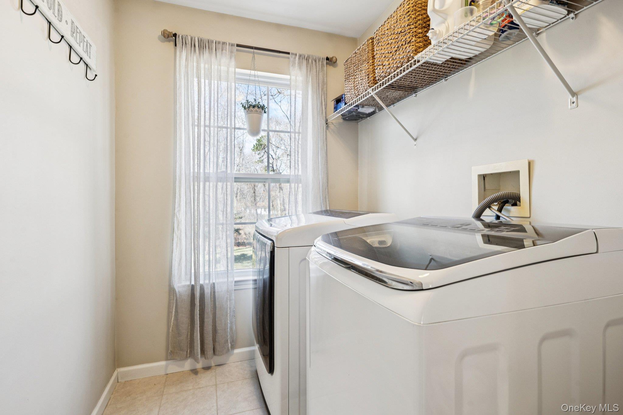 4 Clinton Avenue Bellport, NY 11713 - Photo 27 of 34 a utility room with dryer and washer