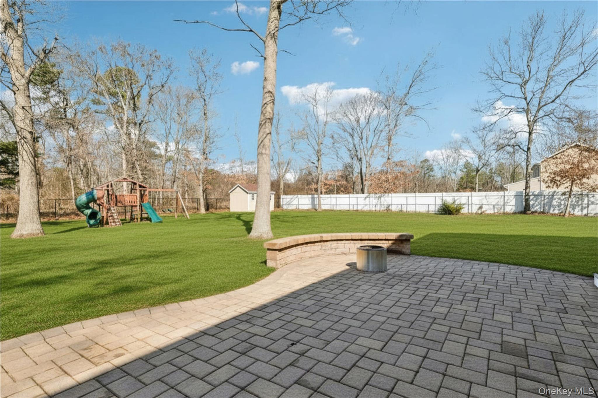 4 Clinton Avenue Bellport, NY 11713 - Photo 31 of 34 a view of a park with large trees