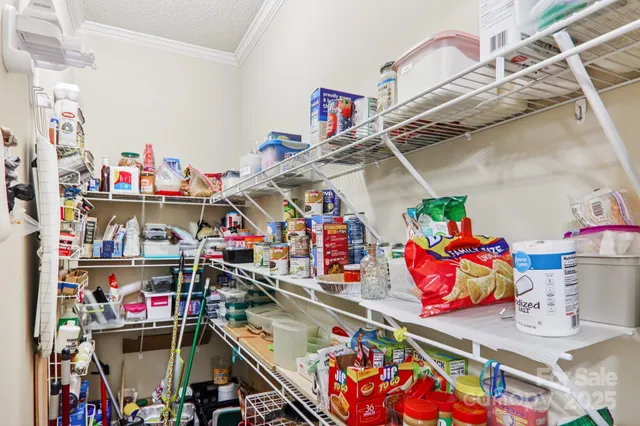 a utility room with lots of clutter and toys