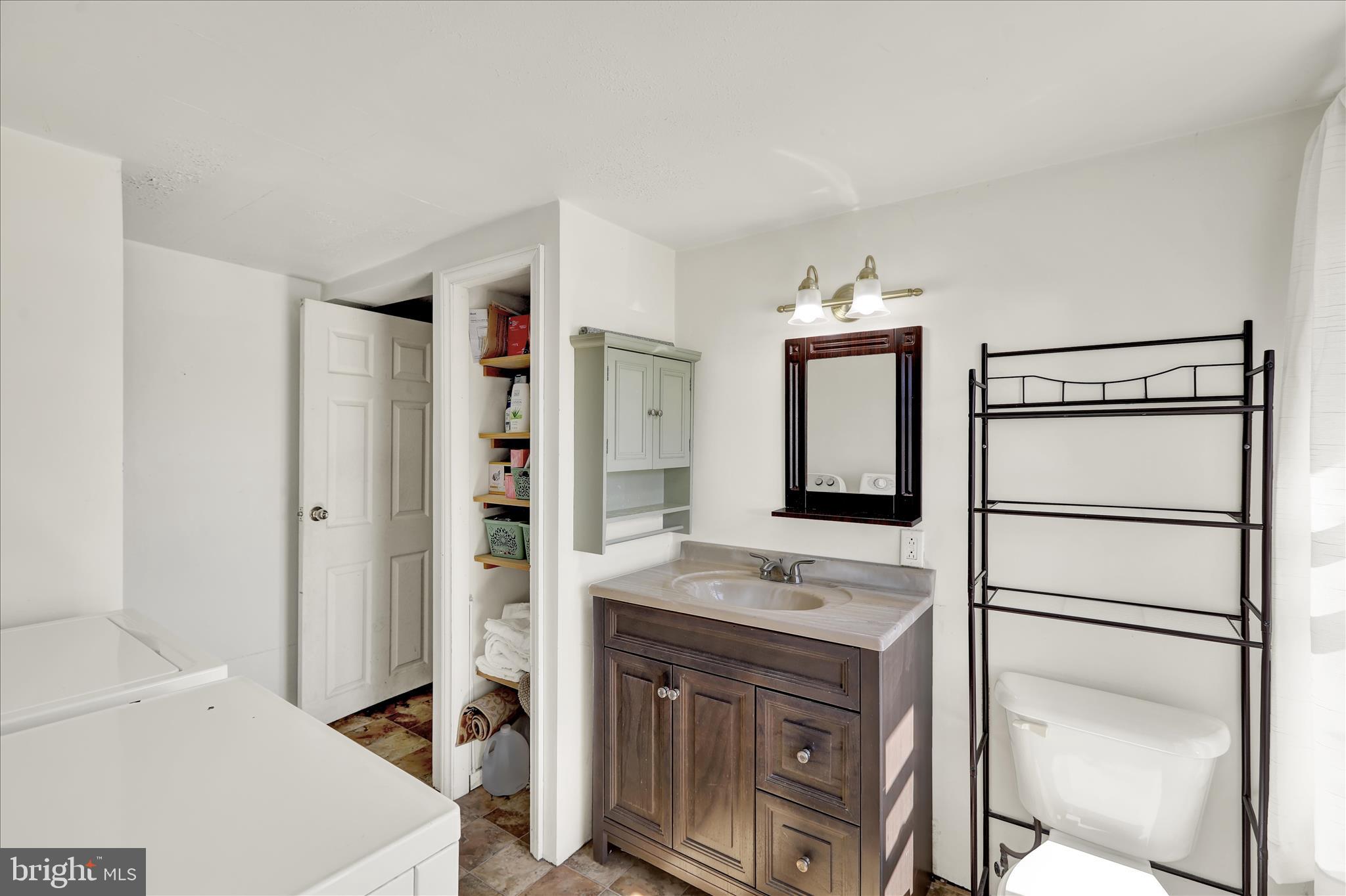 1086 Heffner Lane Reading, PA 19605 - Photo 24 of 44 a en suite bathroom with a sink a vanity and mirror