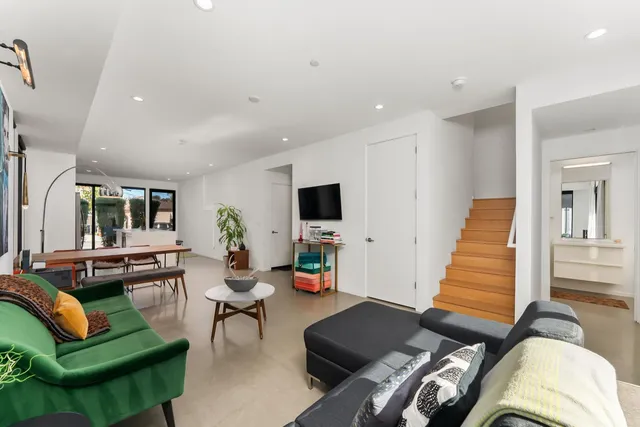 a bathroom with a tub a sink and a mirror