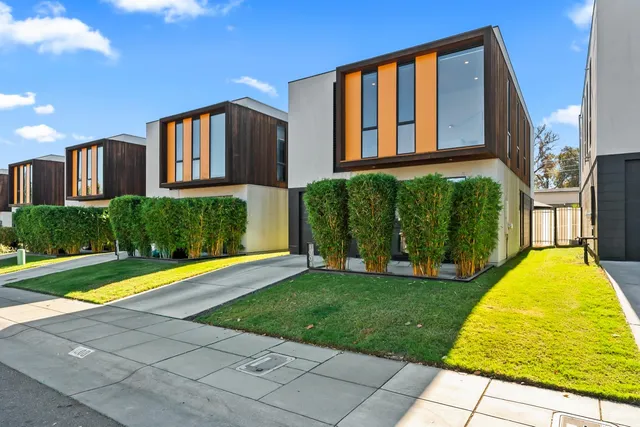 a view of a porch with a table and chairs