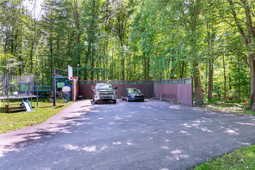 7733 East Port Bay Road Wolcott, NY 14590 - Photo 43 of 49 The enclosed parking space is another addition to this parcel - there’s also a FOUR BAY GARAGE!