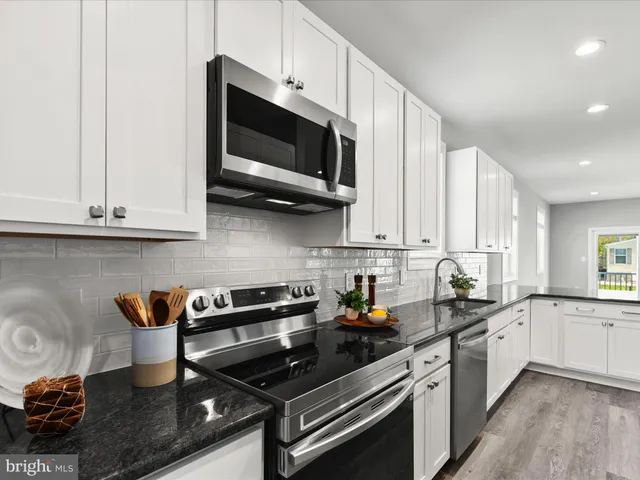 a kitchen with sink cabinets and window