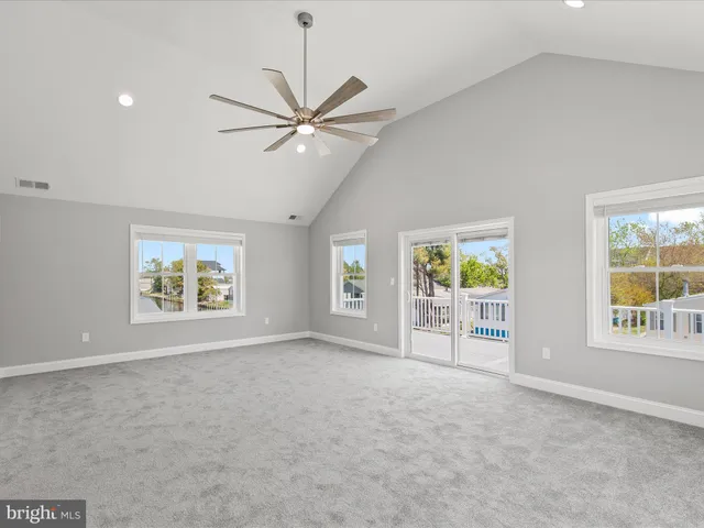 a view of balcony with wooden floor and fence