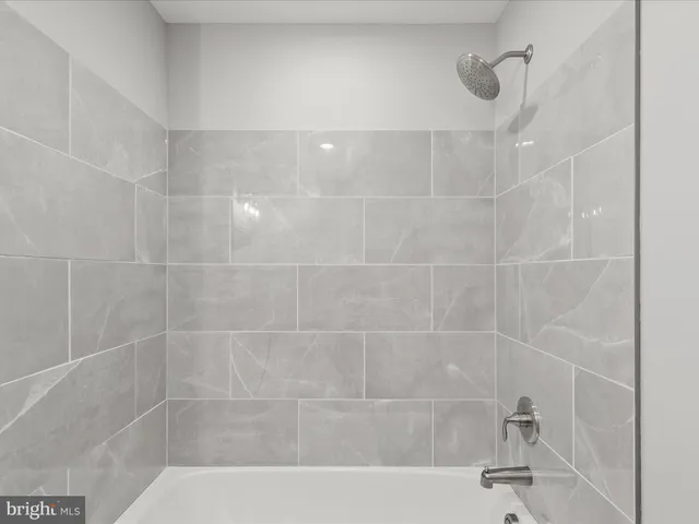 a picture of a bench in front of a wall