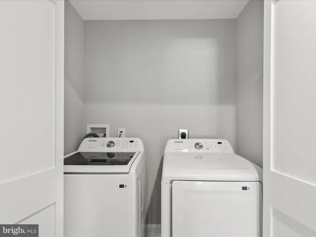 a picture of a room with a white wall and a large window