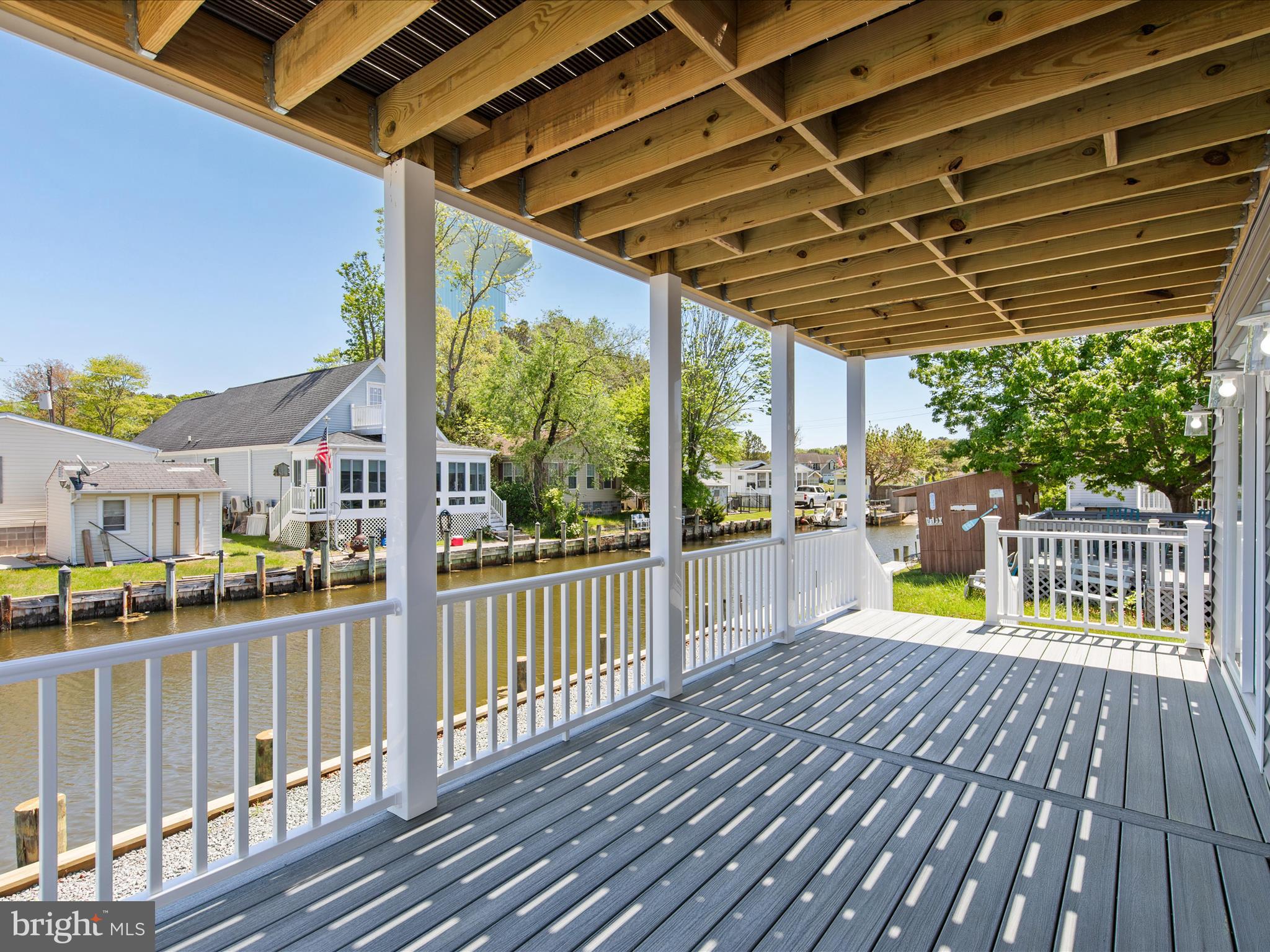 36986 Blue Teal Road Selbyville, DE 19975 - Photo 49 of 54 a view of a balcony with wooden floor
