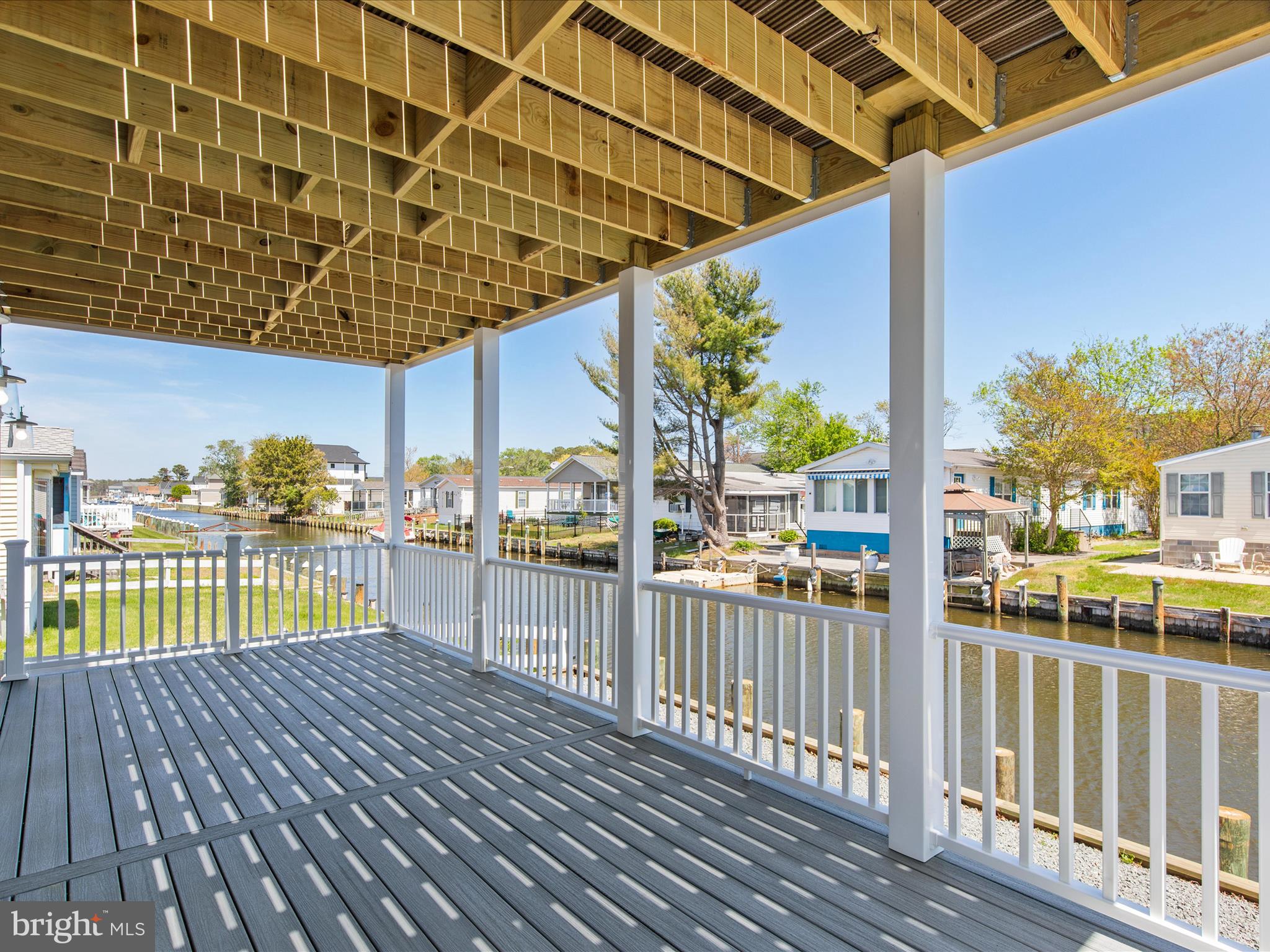 36986 Blue Teal Road Selbyville, DE 19975 - Photo 50 of 54 a view of a balcony with wooden floor