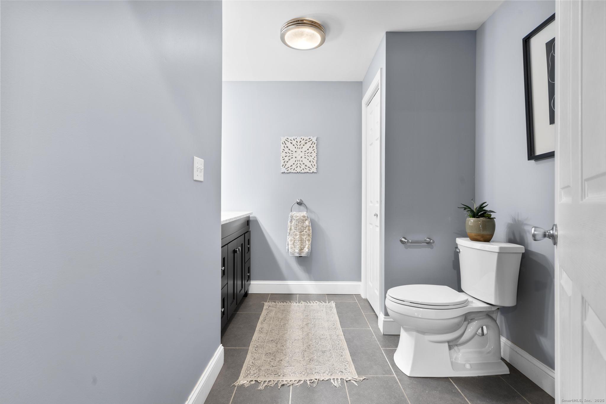 115 Old Wolcott Road Bristol, CT 06010 - Photo 11 of 23 a bathroom with a toilet and a shower