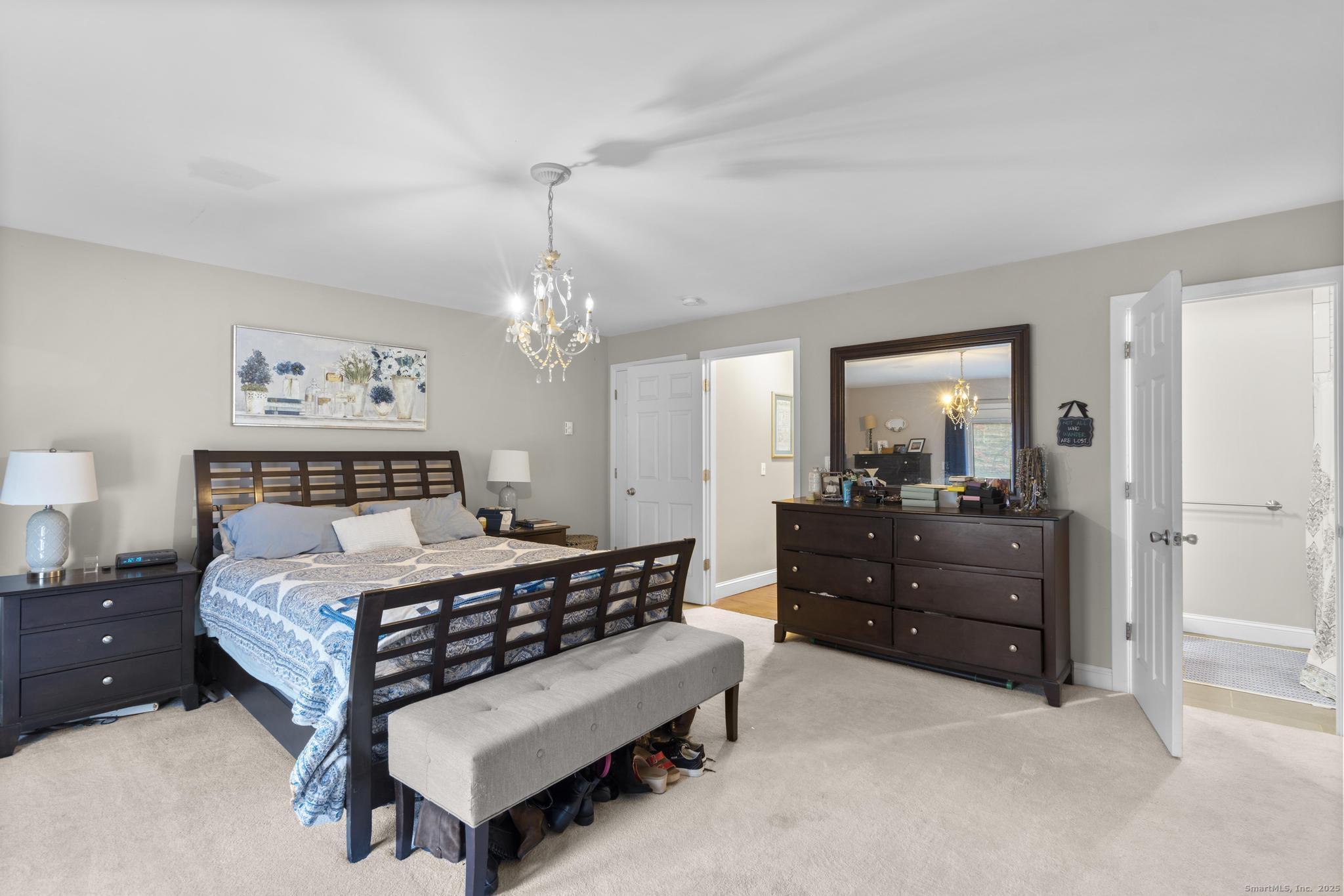 115 Old Wolcott Road Bristol, CT 06010 - Photo 13 of 23 a bedroom with a bed and a mirror on dresser