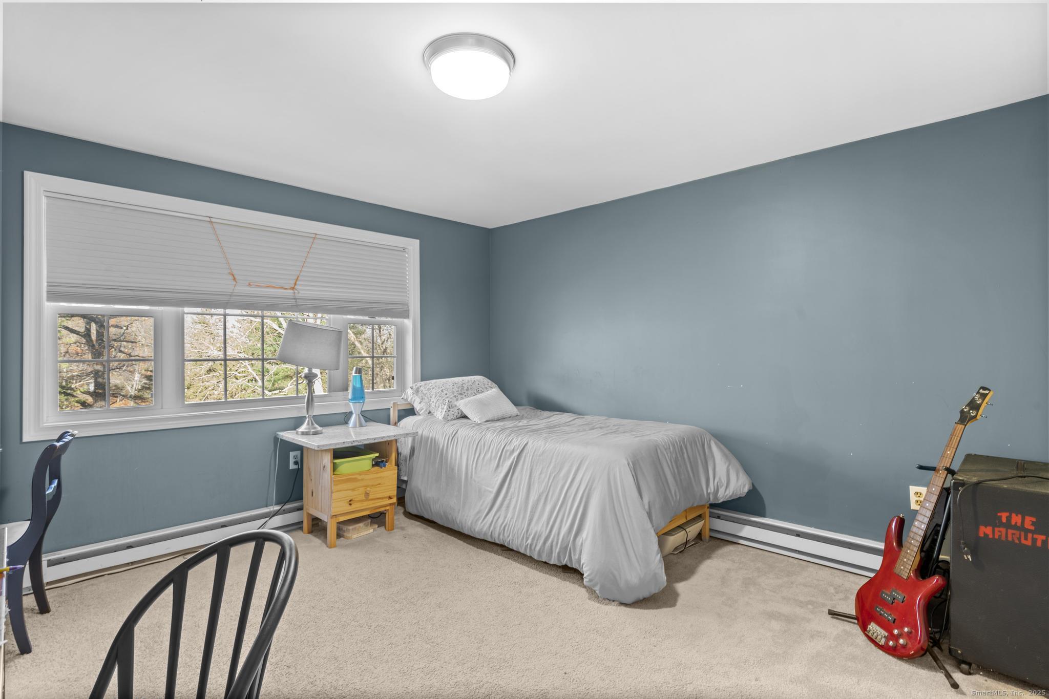 115 Old Wolcott Road Bristol, CT 06010 - Photo 15 of 23 a bed room with a bed and a window