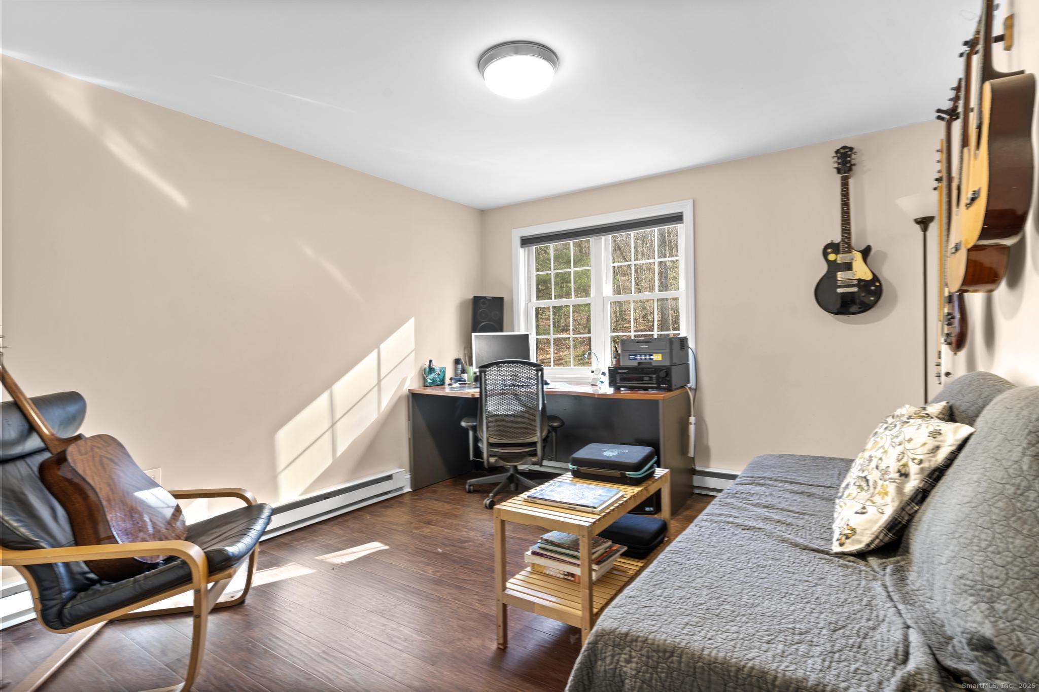 115 Old Wolcott Road Bristol, CT 06010 - Photo 17 of 23 a living room with furniture and a window