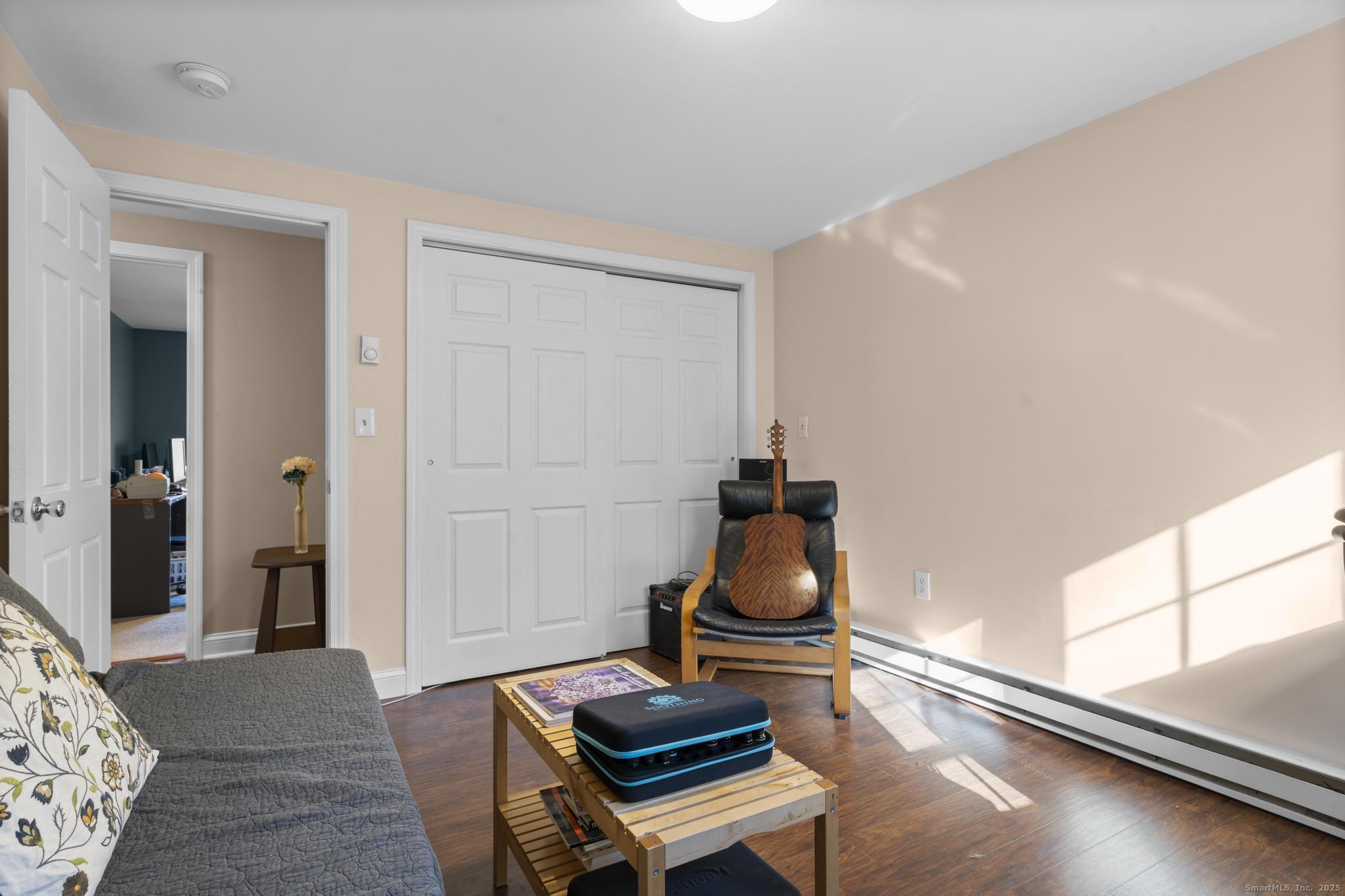 115 Old Wolcott Road Bristol, CT 06010 - Photo 18 of 23 a living room with furniture and a window