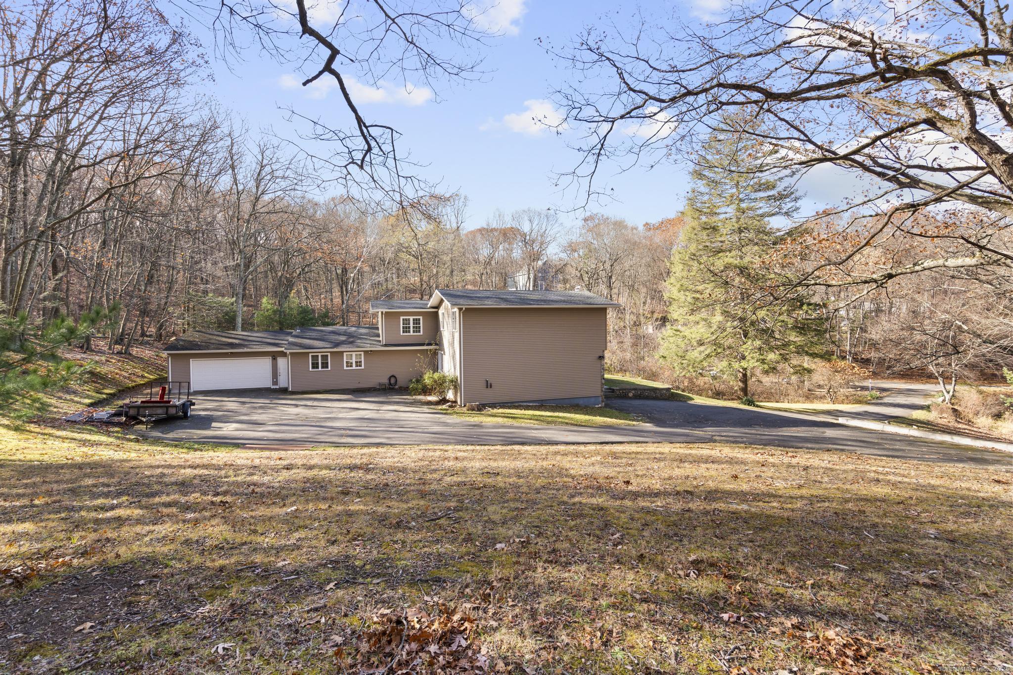 115 Old Wolcott Road Bristol, CT 06010 - Photo 20 of 23 a view of back yard of the house