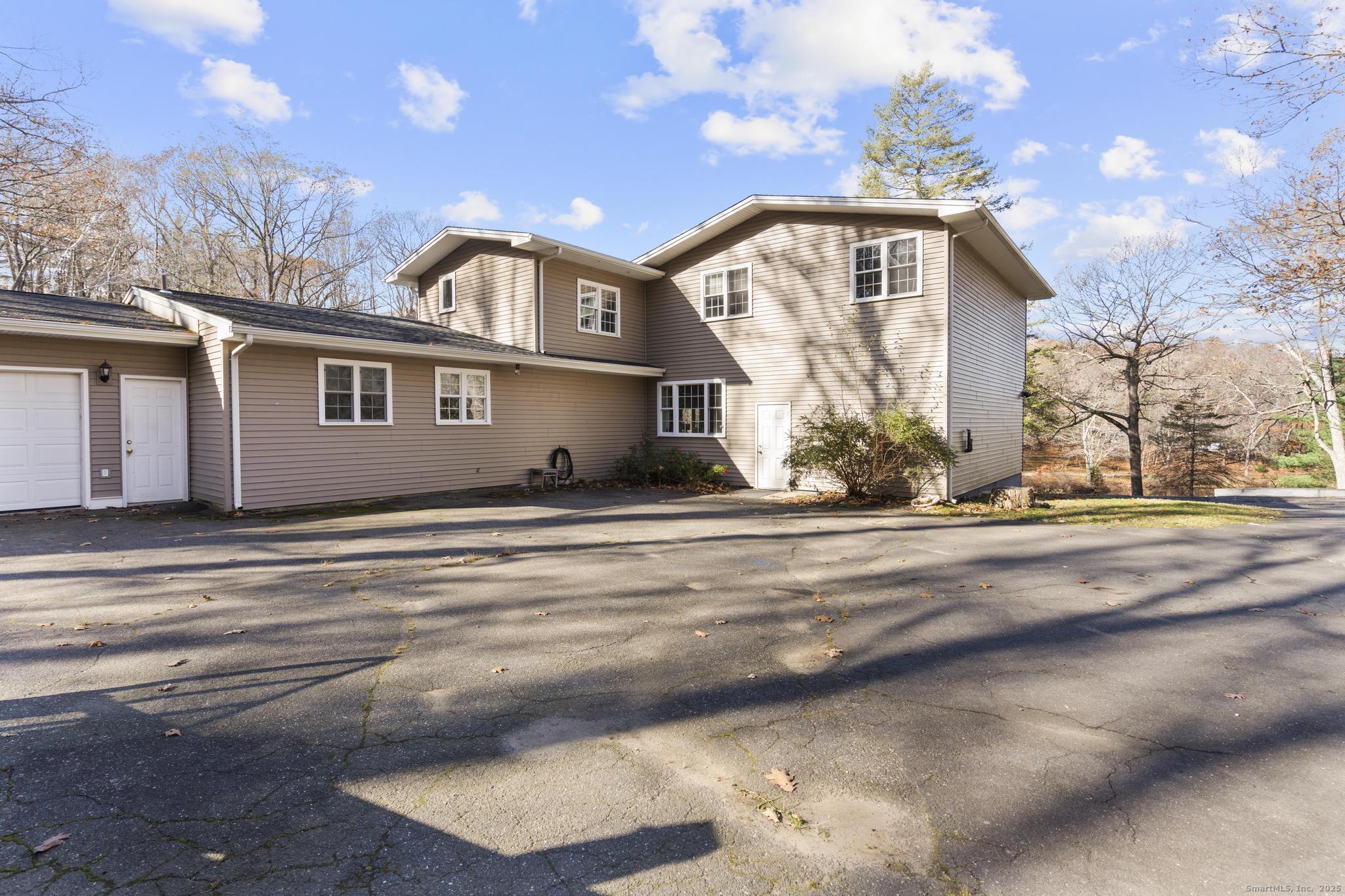 115 Old Wolcott Road Bristol, CT 06010 - Photo 21 of 23 a front view of a house with a yard