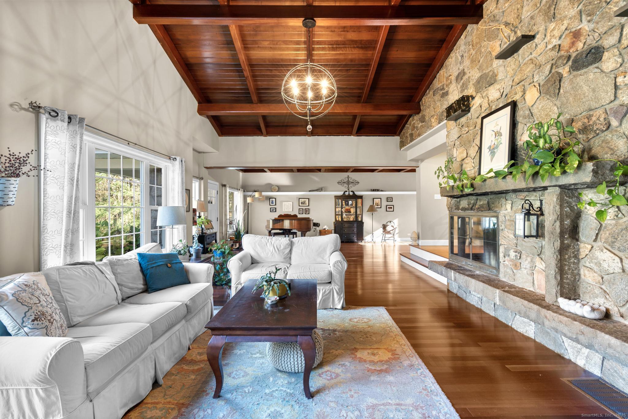 115 Old Wolcott Road Bristol, CT 06010 - Photo 6 of 23 a living room with furniture and a fireplace