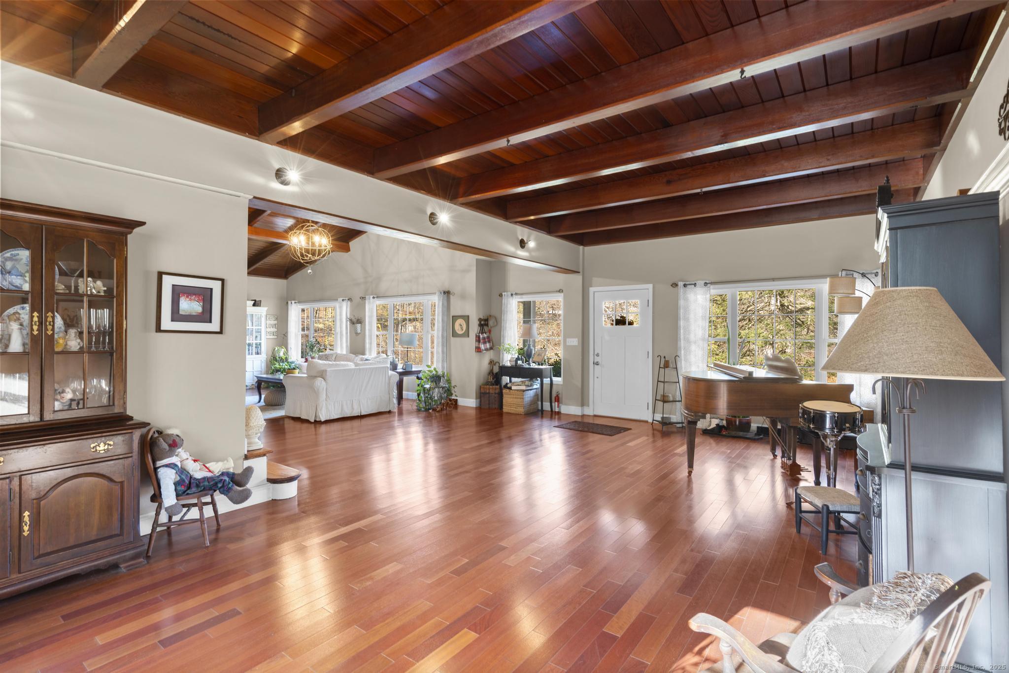 115 Old Wolcott Road Bristol, CT 06010 - Photo 7 of 23 a livingroom with furniture wooden floor a chandelier