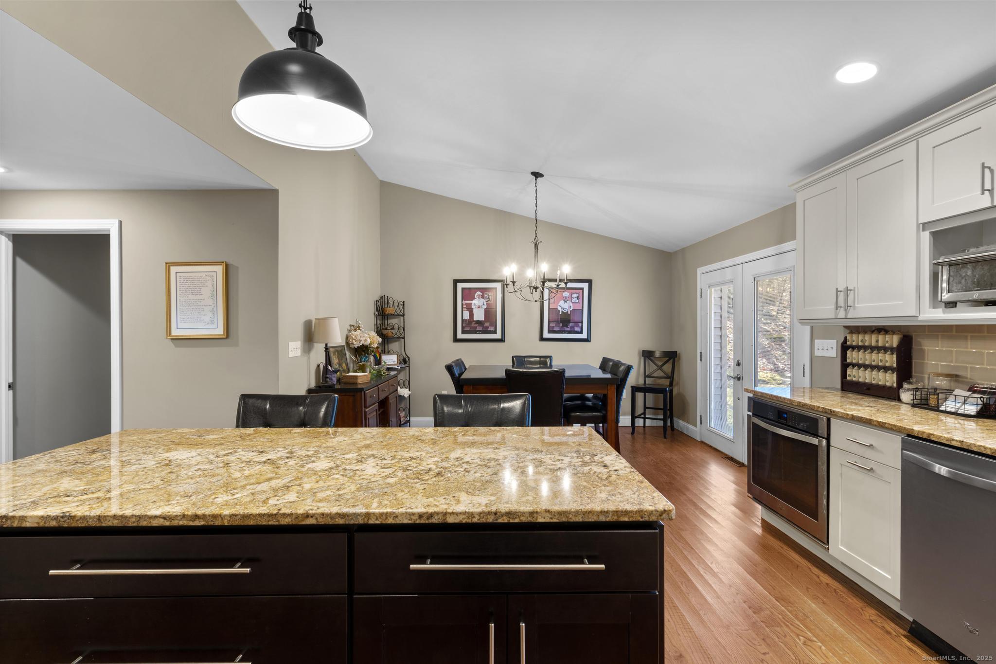 115 Old Wolcott Road Bristol, CT 06010 - Photo 10 of 23 a kitchen with granite countertop kitchen island stainless steel appliances a sink and counter space